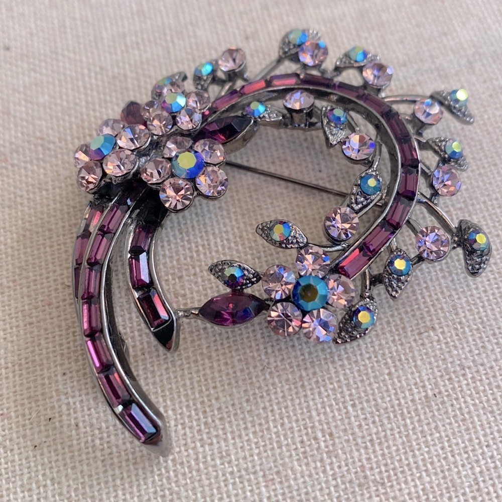 Vintage rhinestone brooch pin. Florals in shade of pink and amethyst violet.